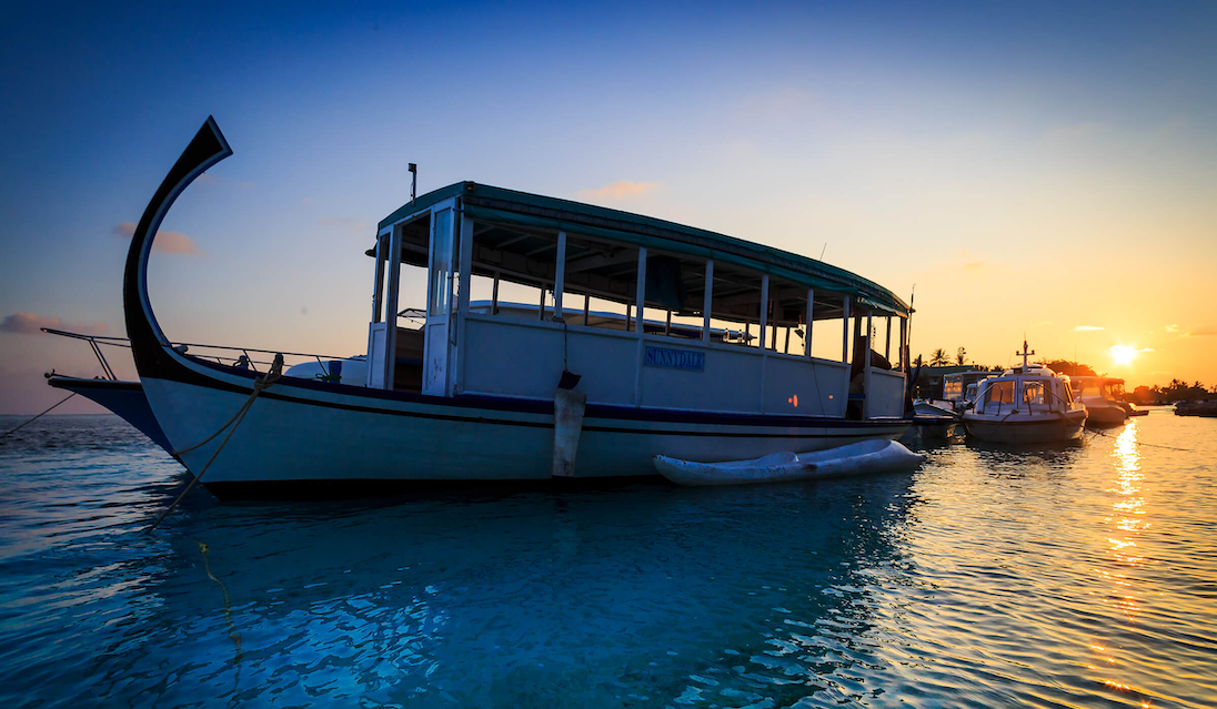 A boat moored at sunset before compression